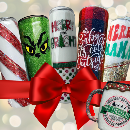 A group of holiday themed tumblers with a bow.