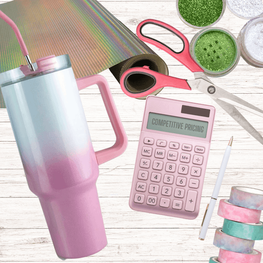 a pink and white cup with a pink straw and a calculator and other items